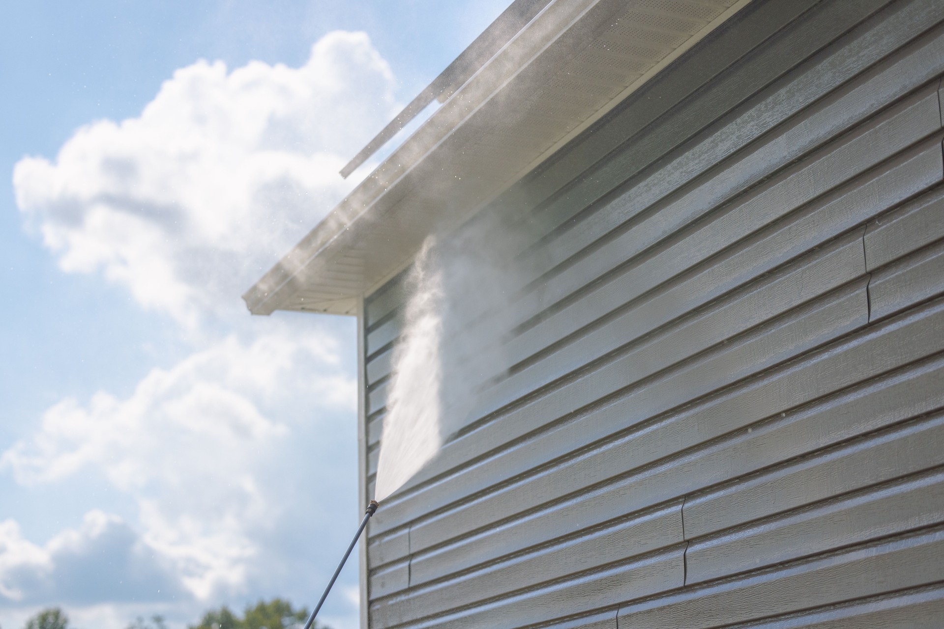 Pressure Washing Vinyl Siding - House - Sunny